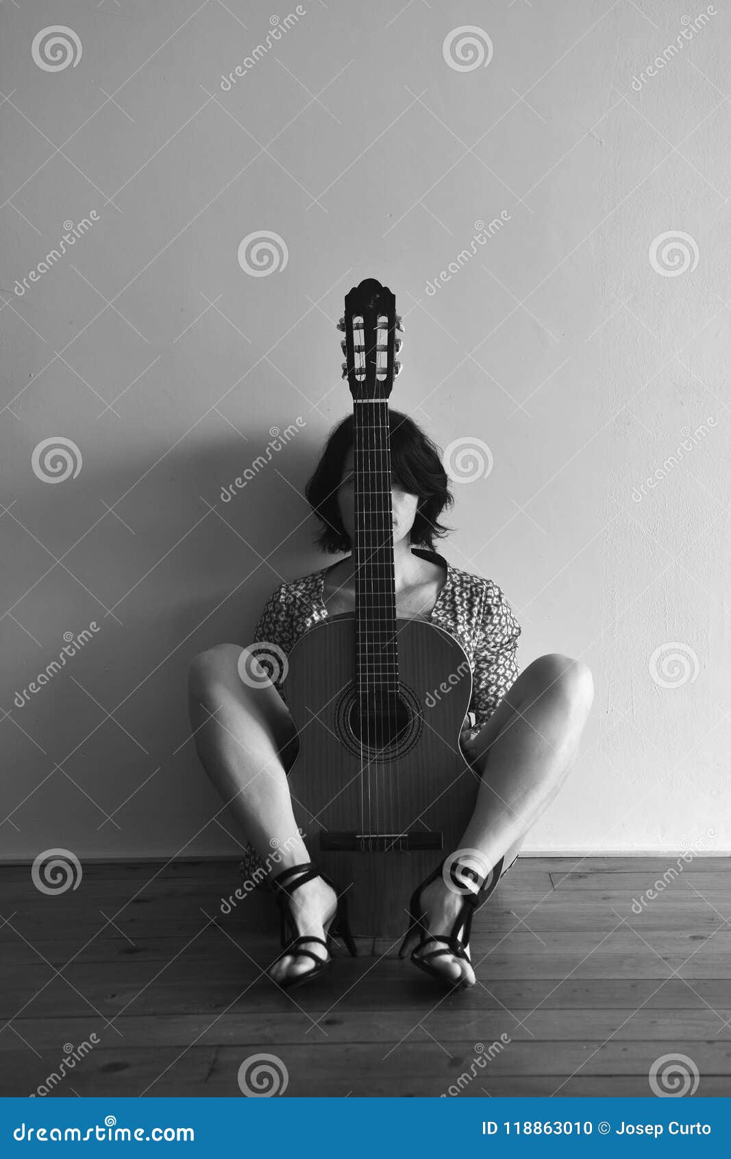 woman sitting with a guitar