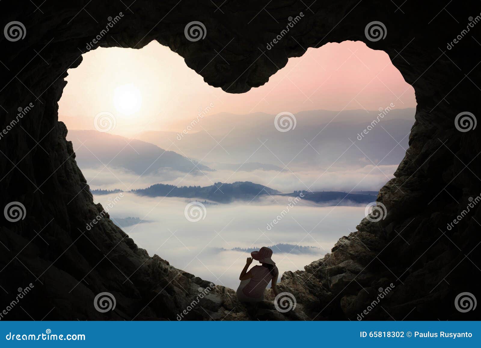 Woman Sitting Inside Cave and Enjoy Mountain View Stock Photo - Image ...