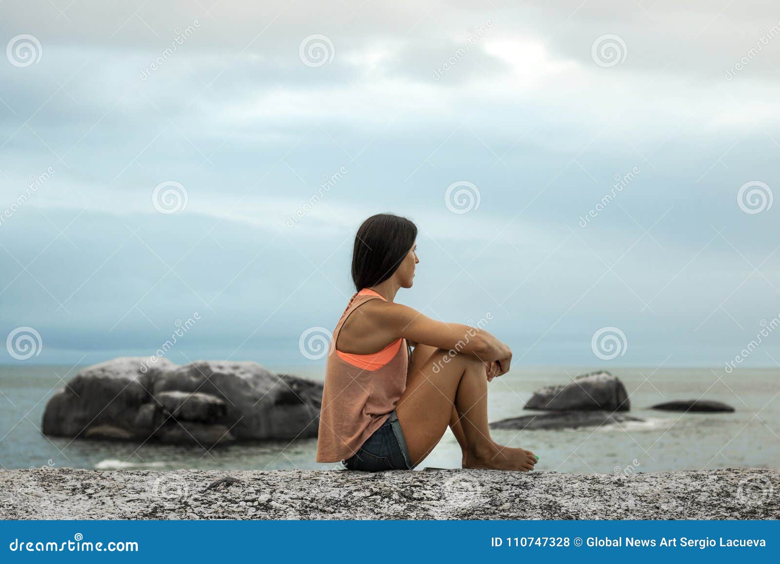 Woman Sitting On A Rock At Sunset On Bakovern Beach Cape Town Stock Photo Image Of Ocean