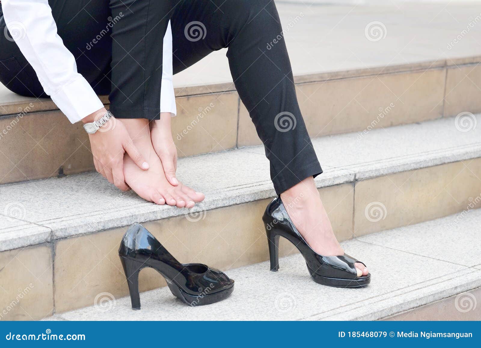 Woman Sitting on Sofa in Room Catch Her Foot and she Has Foot Pain ...