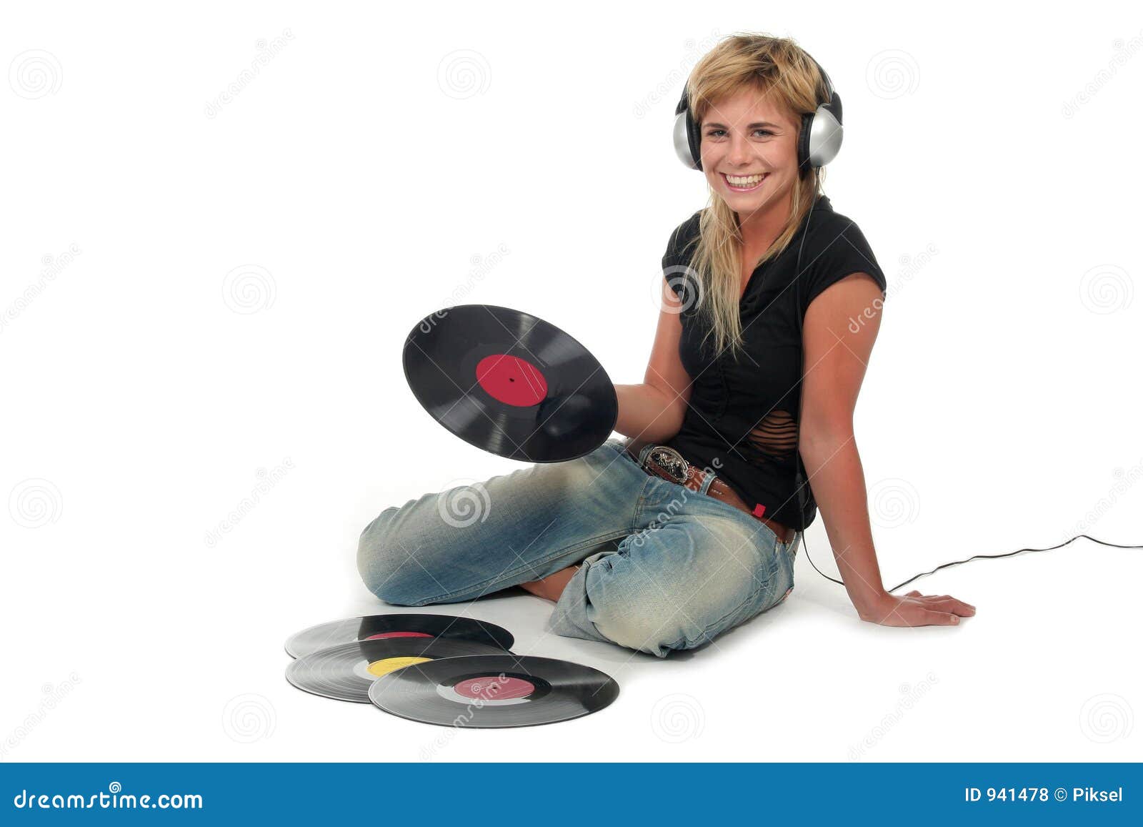 woman sitting with vinyl records