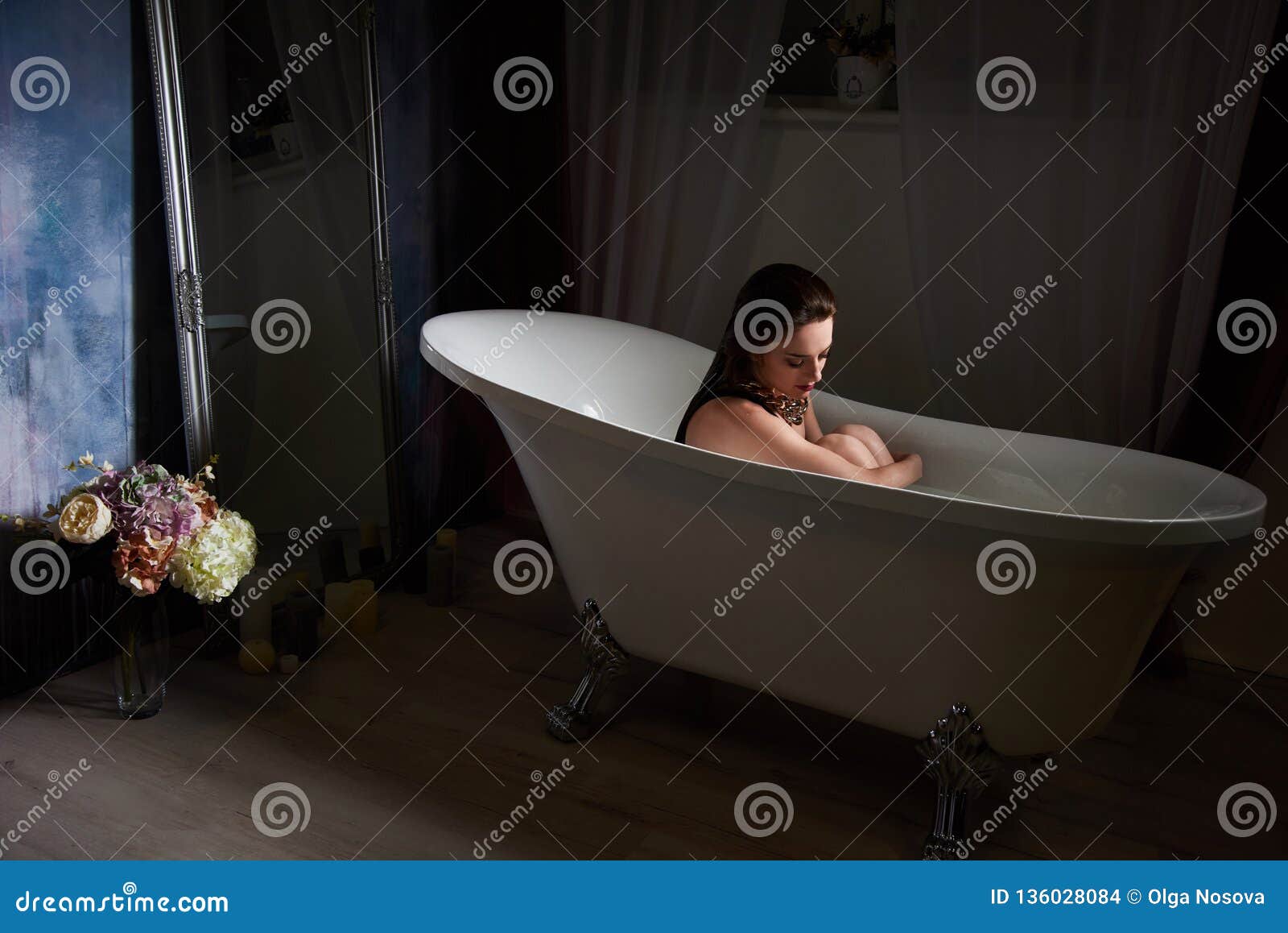 Beautiful Young Woman Taking Care About Legs Lying In The Bath Tube In