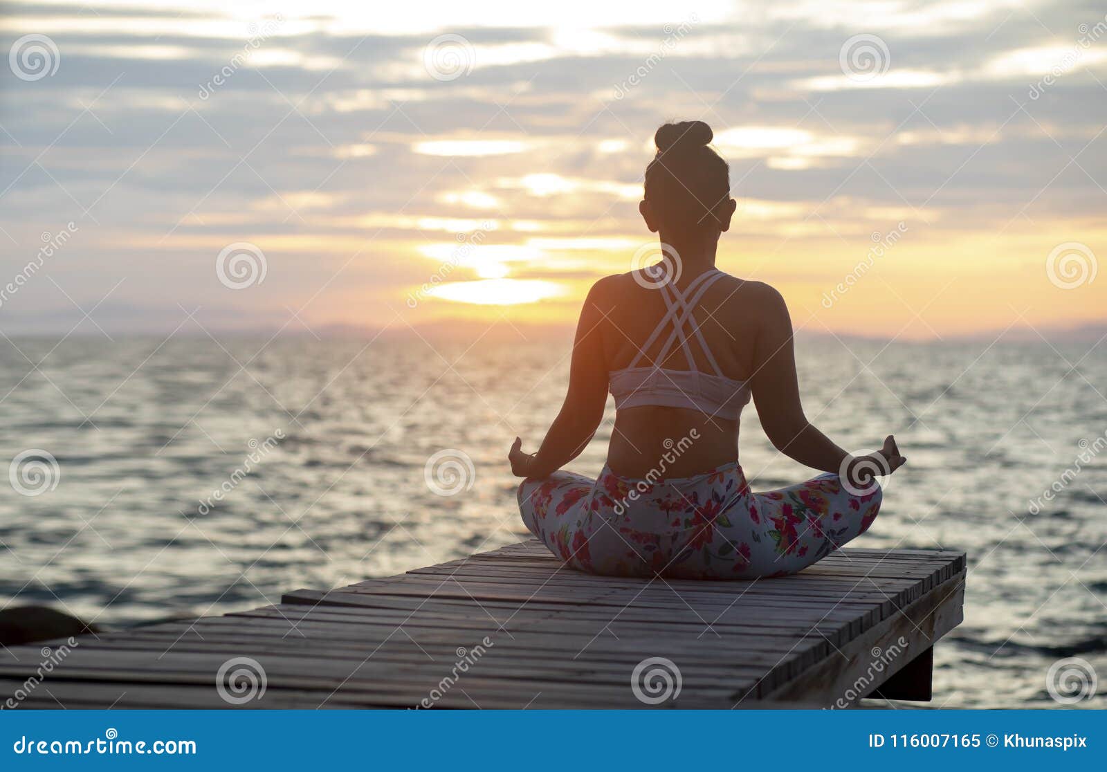 Female Yoga Poses Side View Shot Of Smiling Beautiful Young Sporty And Slim  Woman In Lotus Position Is Meditating On The Sand On The Morning Beach  Stock Photo - Download Image Now -