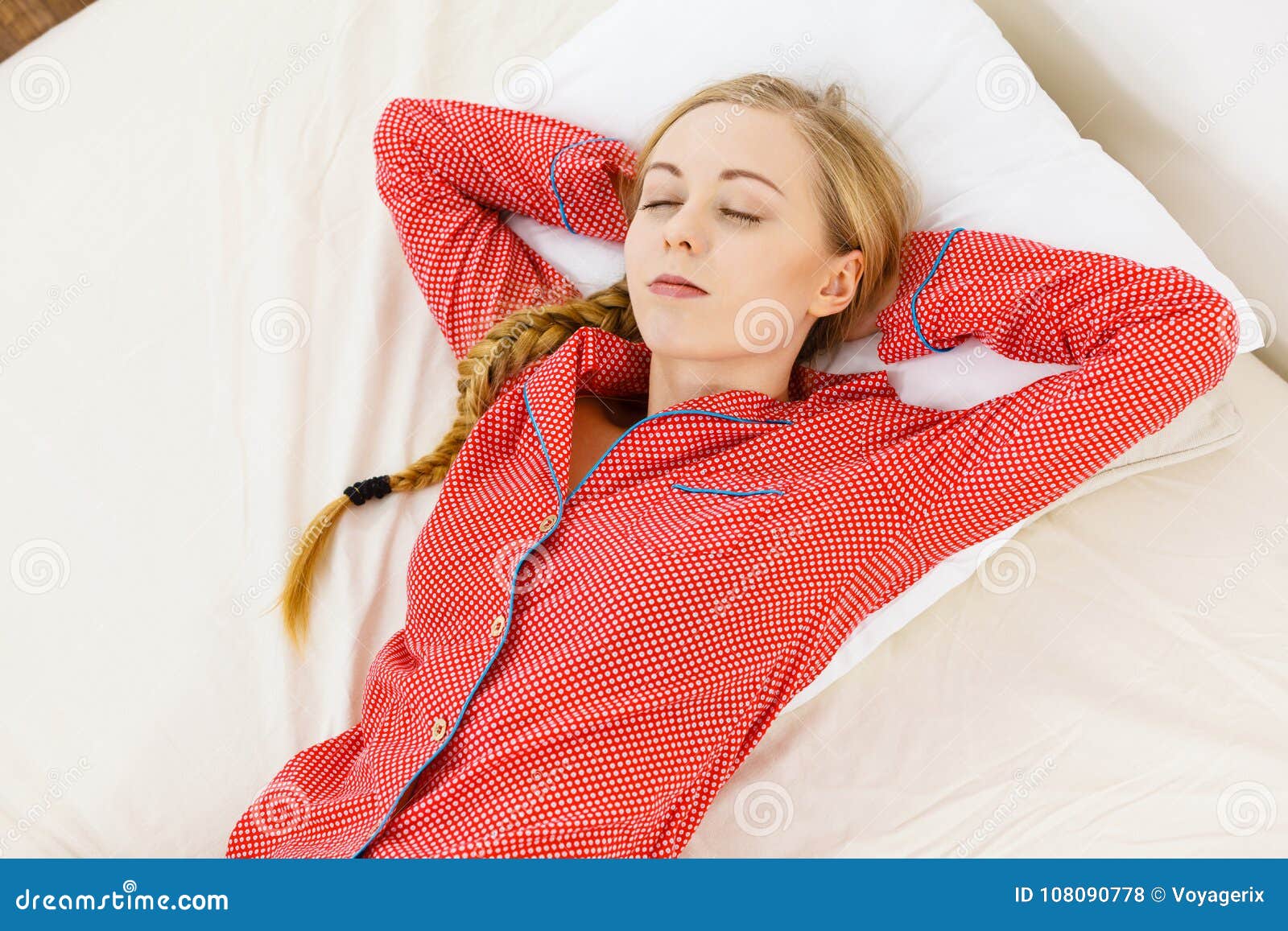 woman sleeping in bed on back