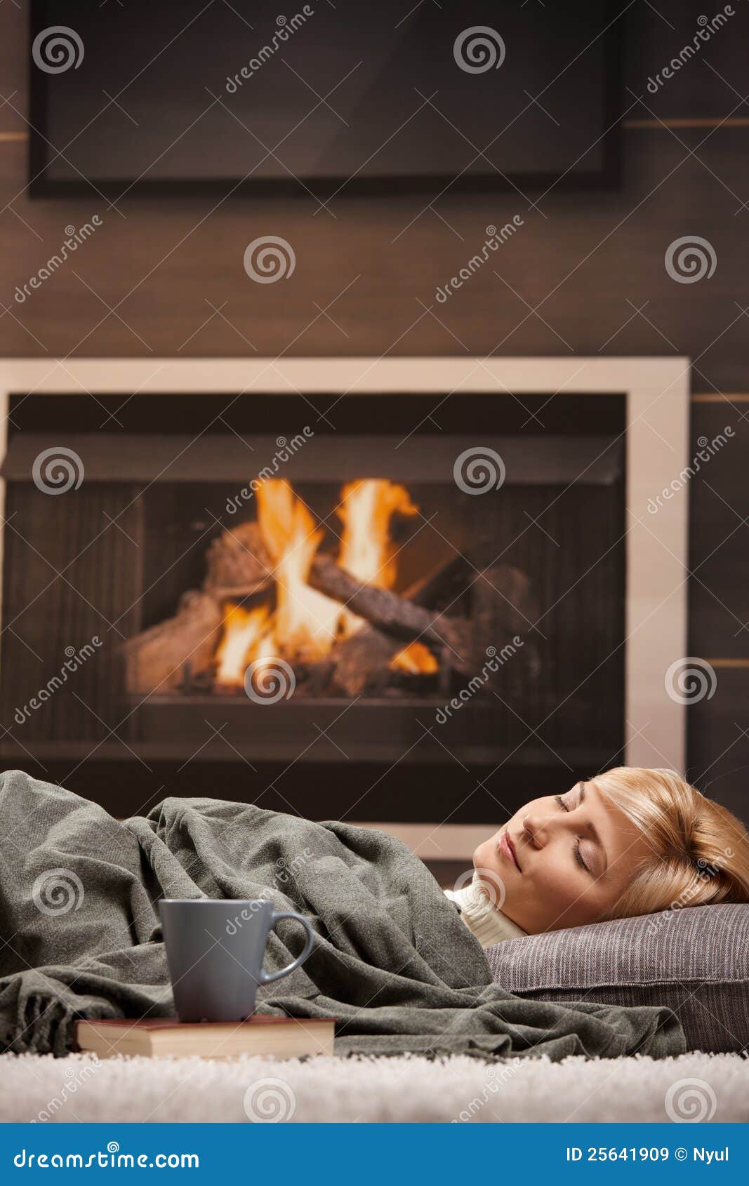 sleeping in front of a fire
