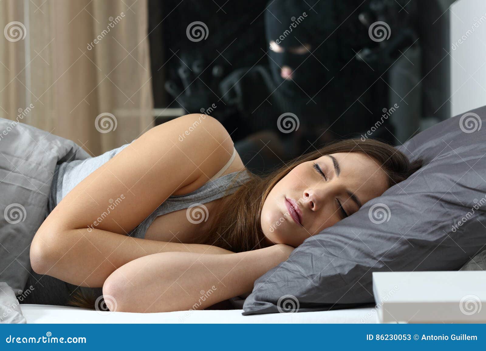 woman sleeping with an intruder watching