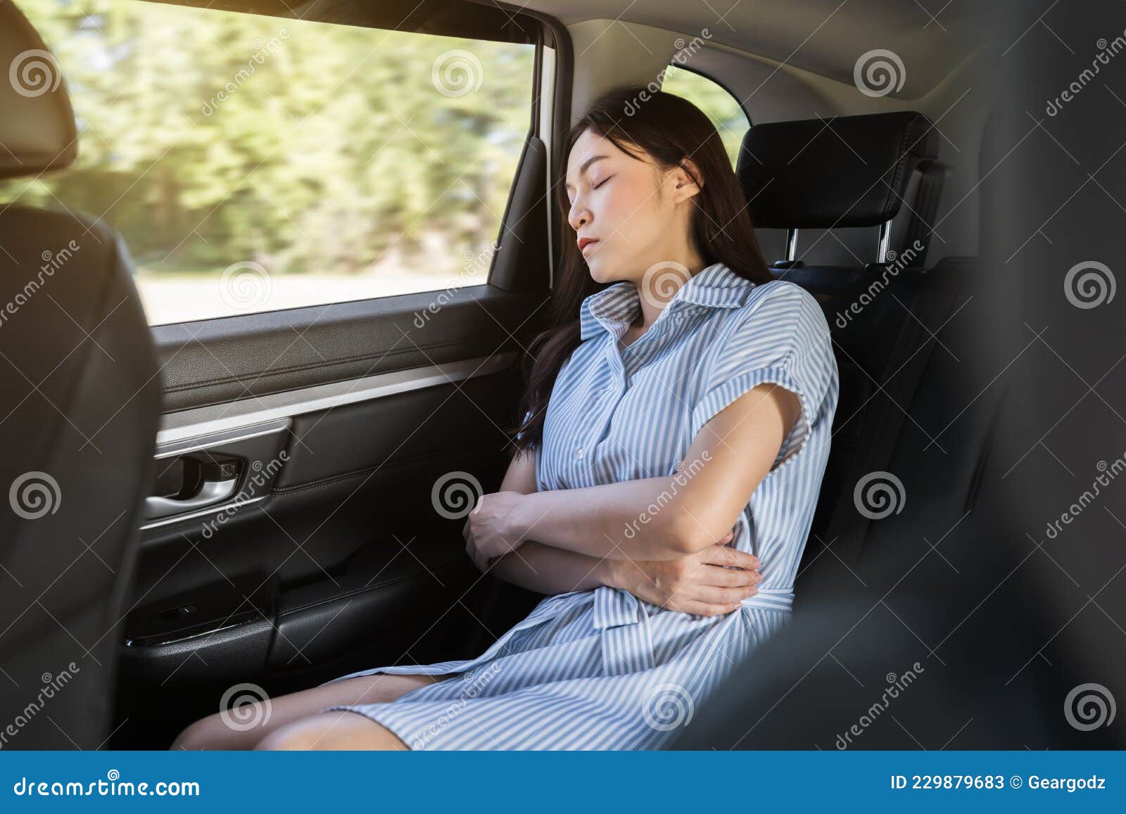 Woman Sleeping while Sitting in the Back Seat of Car Stock Image