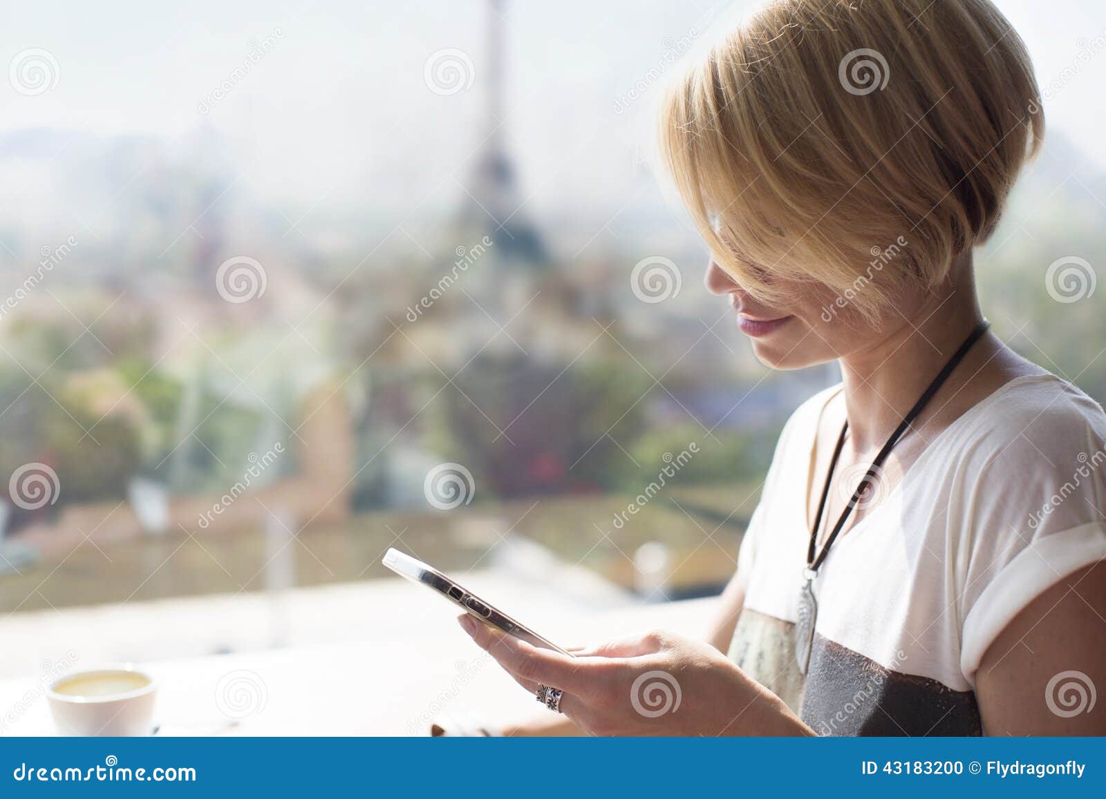 woman smartphone paris cafe