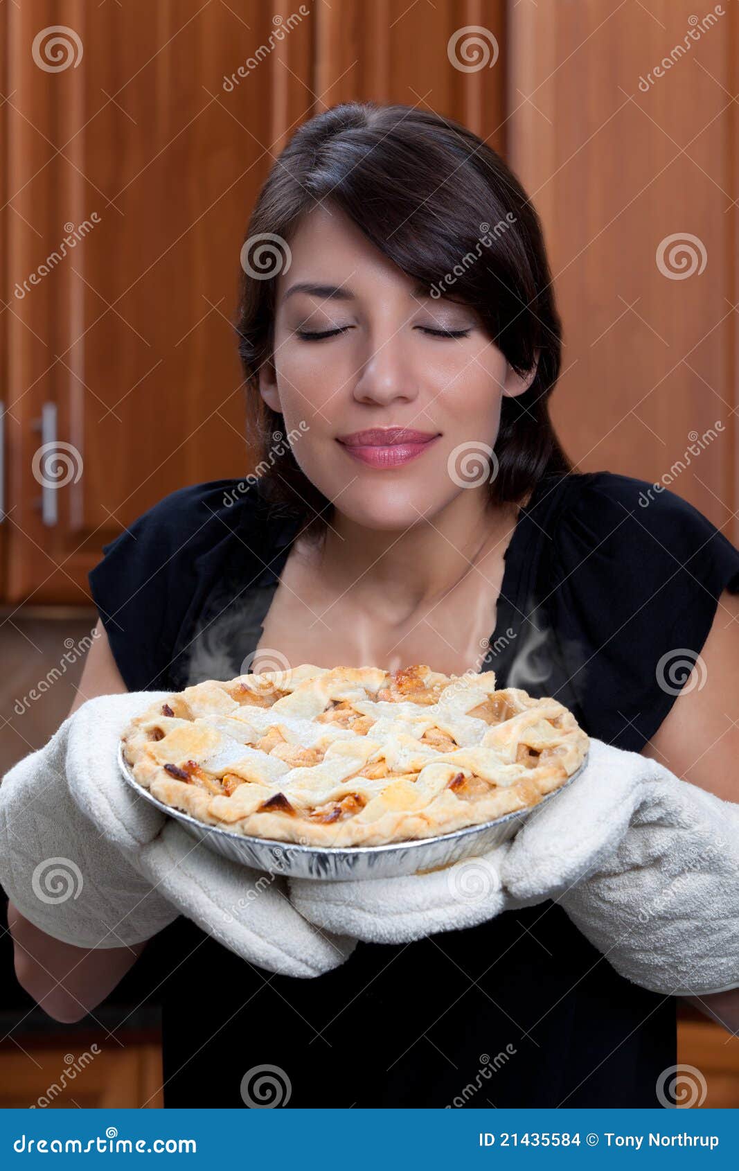 Woman smelling apple pie stock photo. Image of aroma 21435584