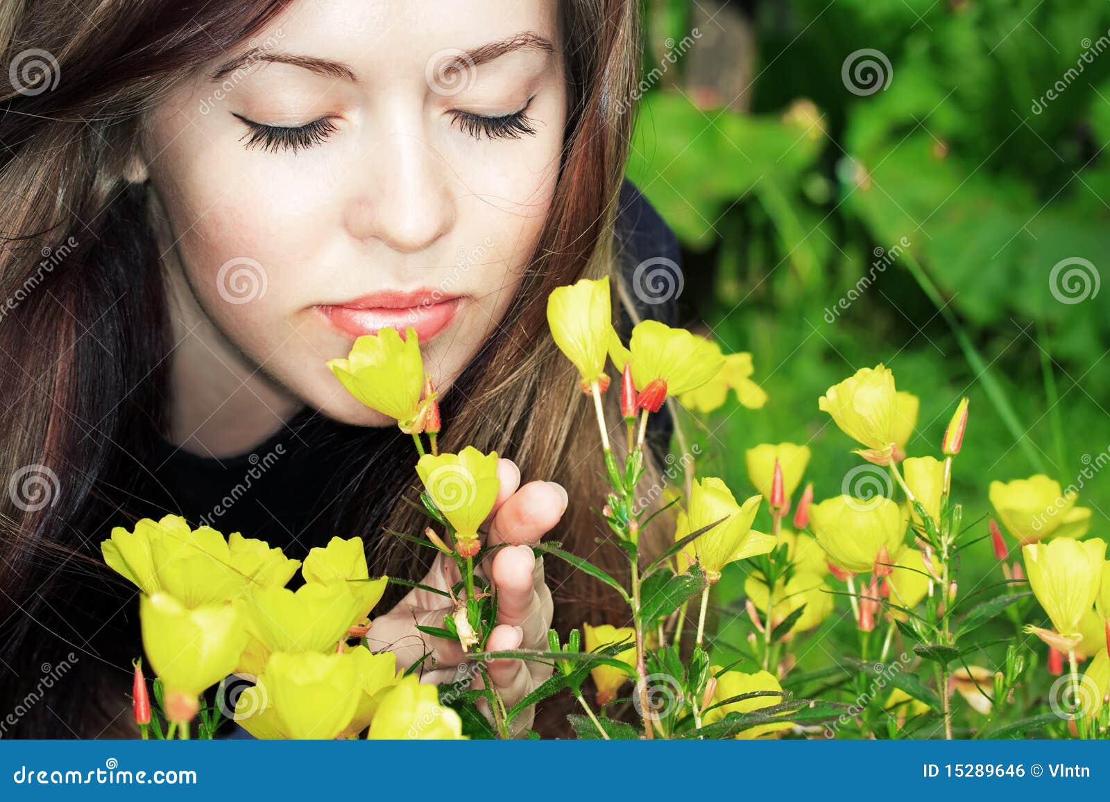 Woman smelling flowers stock photo. Image of maiden, femininity 15289646