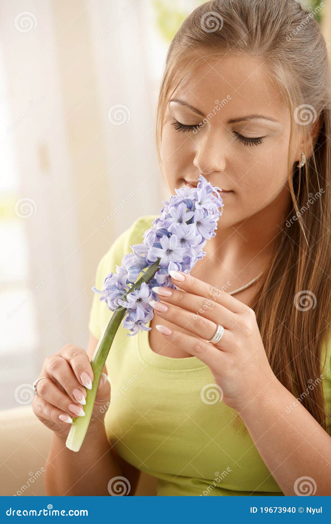 Woman smelling flowers stock photo. Image of green, fragrance 19673940