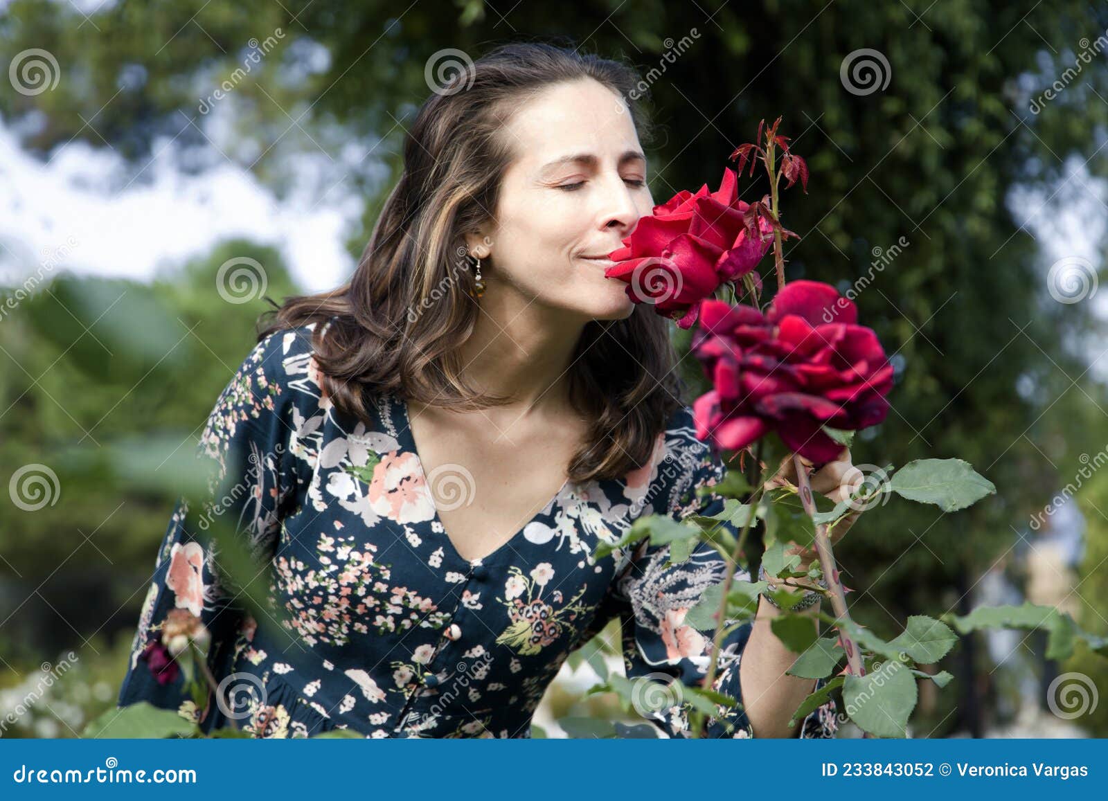 Woman Smelling A Rose With Her Eyes Closed Stock Photo Image Of Green