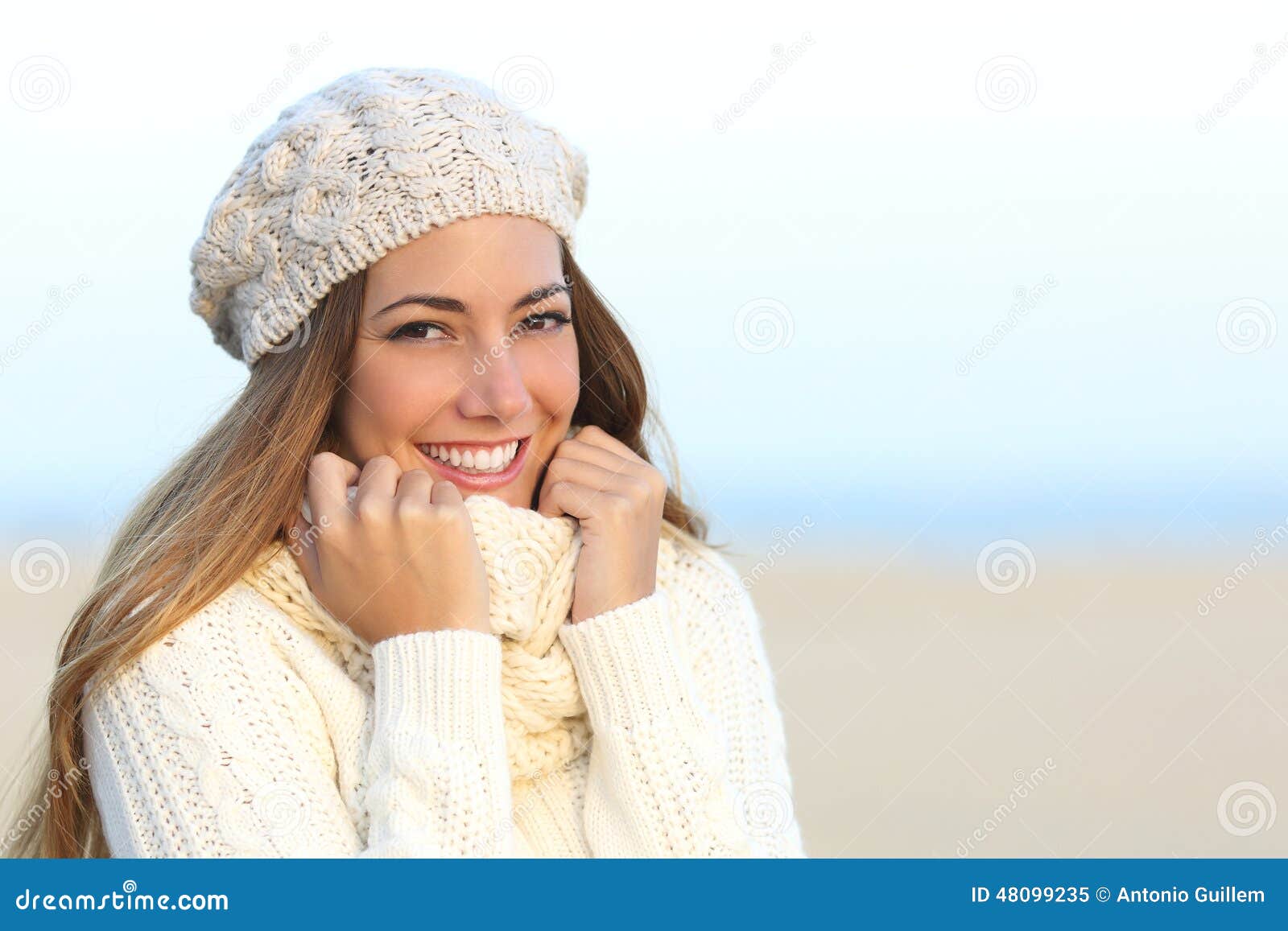 woman smile with a perfect white teeth in winter