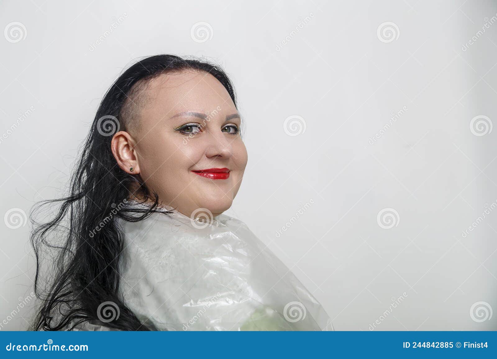 Woman Smiling with Half Shaved Head in Barber Chair. Stock Image