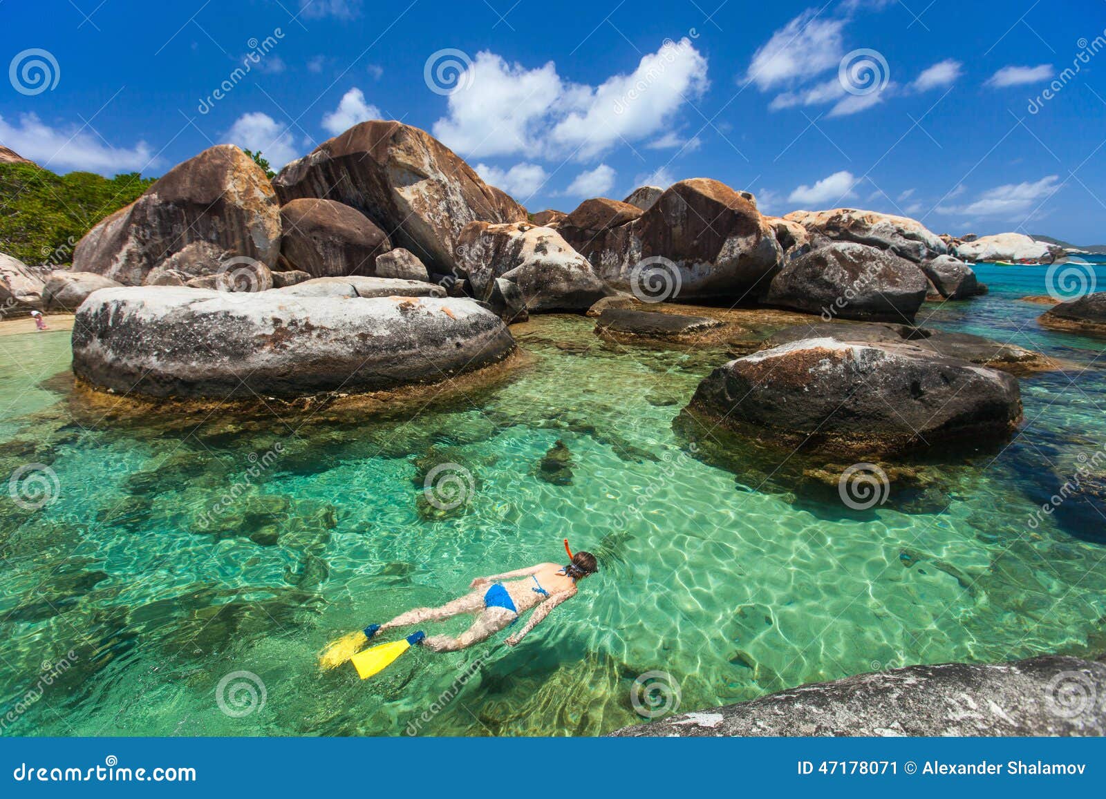 woman snorkeling at tropical water