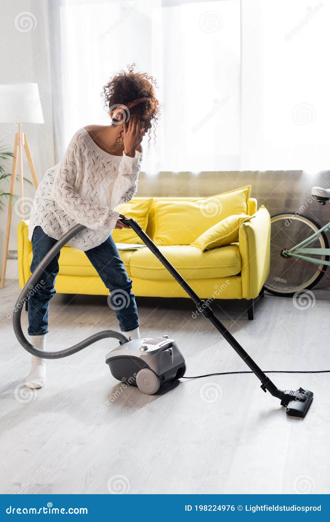 Woman in Socks Using Vacuum Cleaner Stock Photo Image of sofa, clean