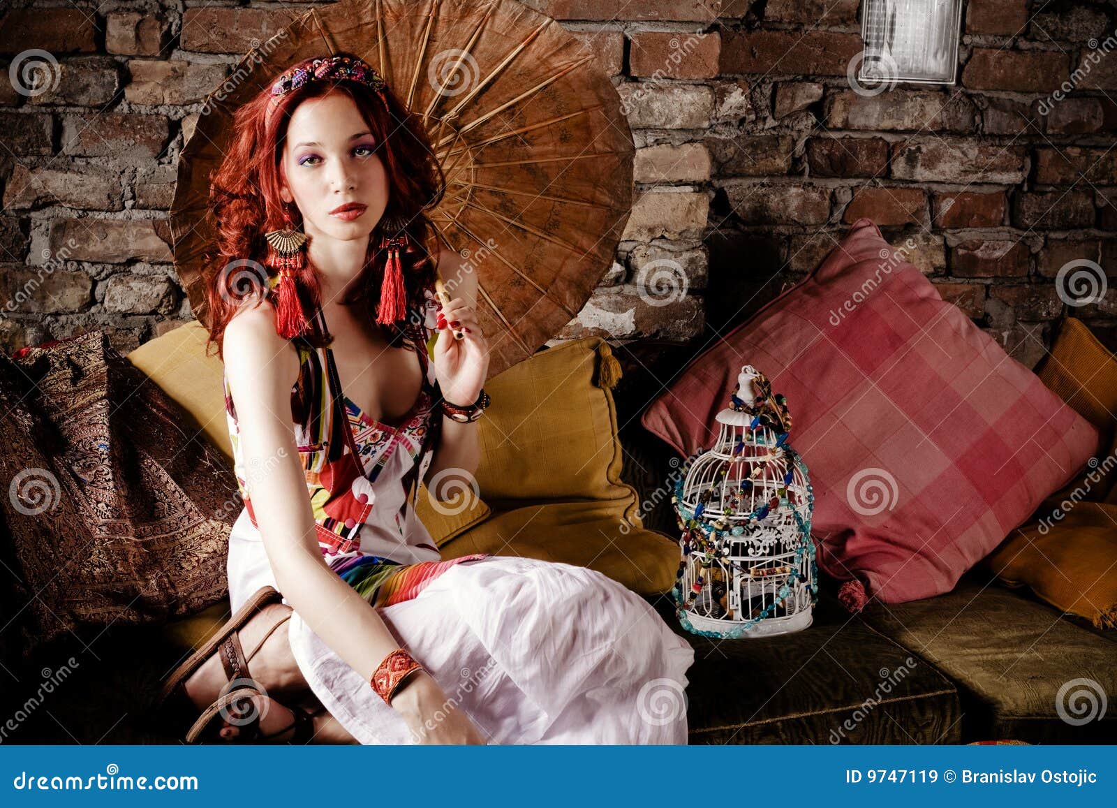 woman on sofa with parasol