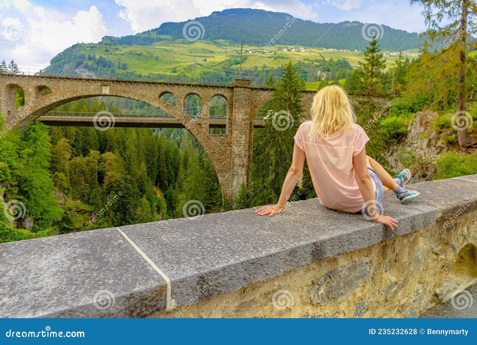 woman on solis viaduct of swiss railway