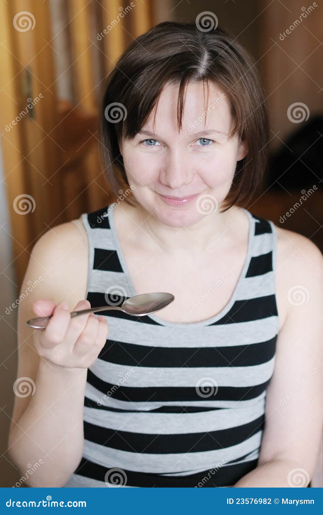Woman with spoon stock photo. Image of head, indoors 23576982