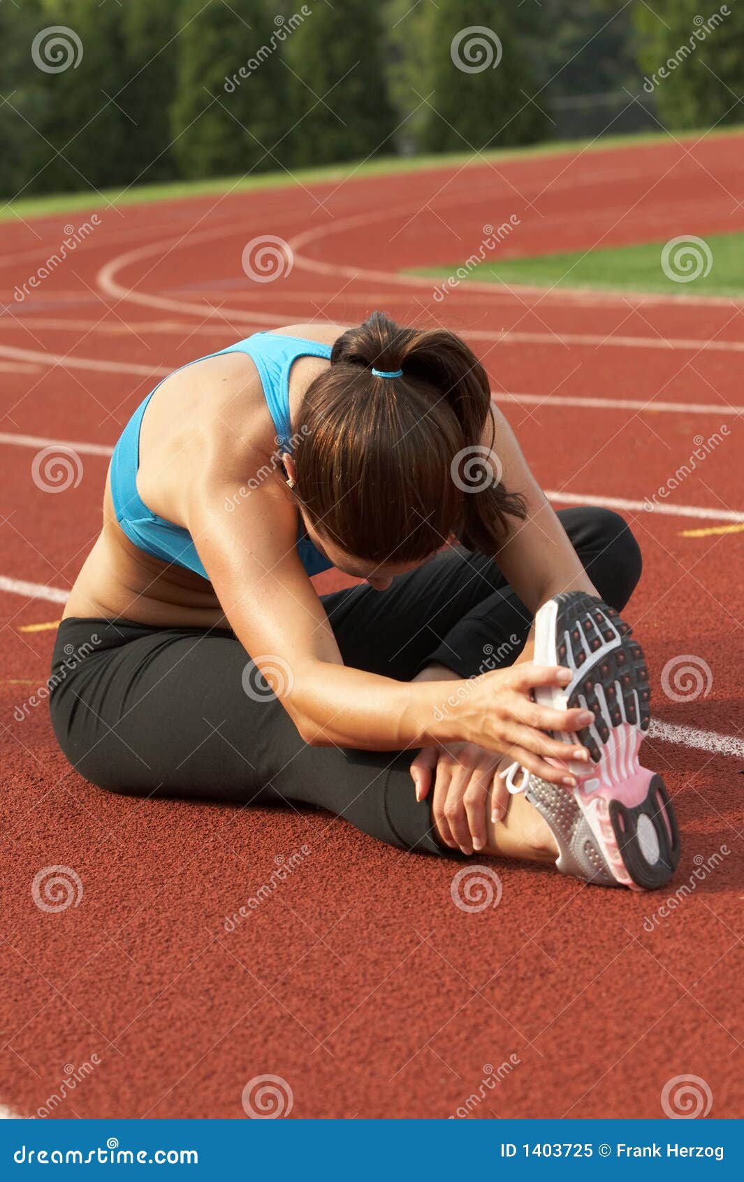 Woman in Sports Bra Leaning and Stretching Leg and Hamstring Stock Image Image of teal, track