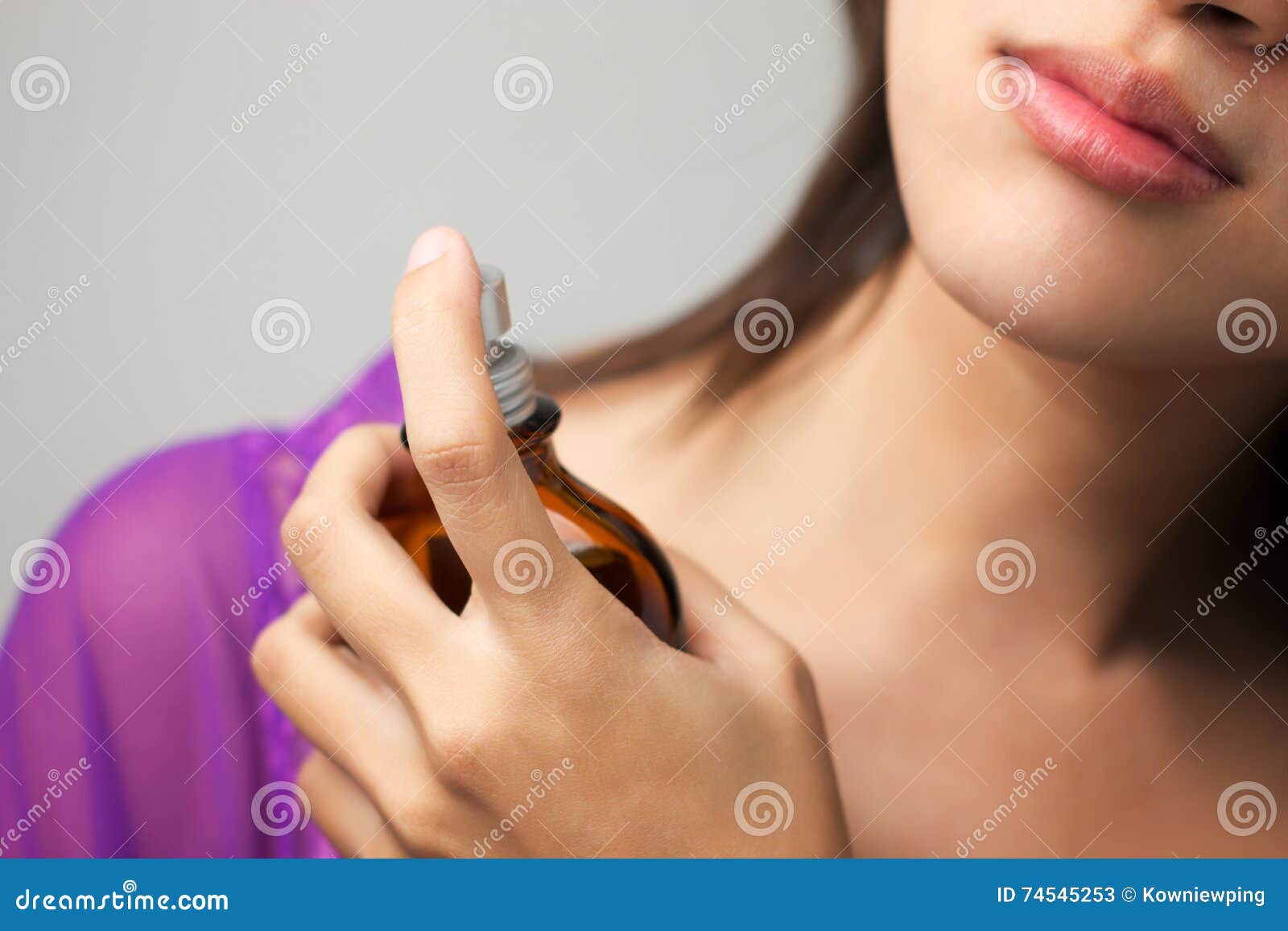 Woman spraying perfume stock image. Image of fragrant 74545253