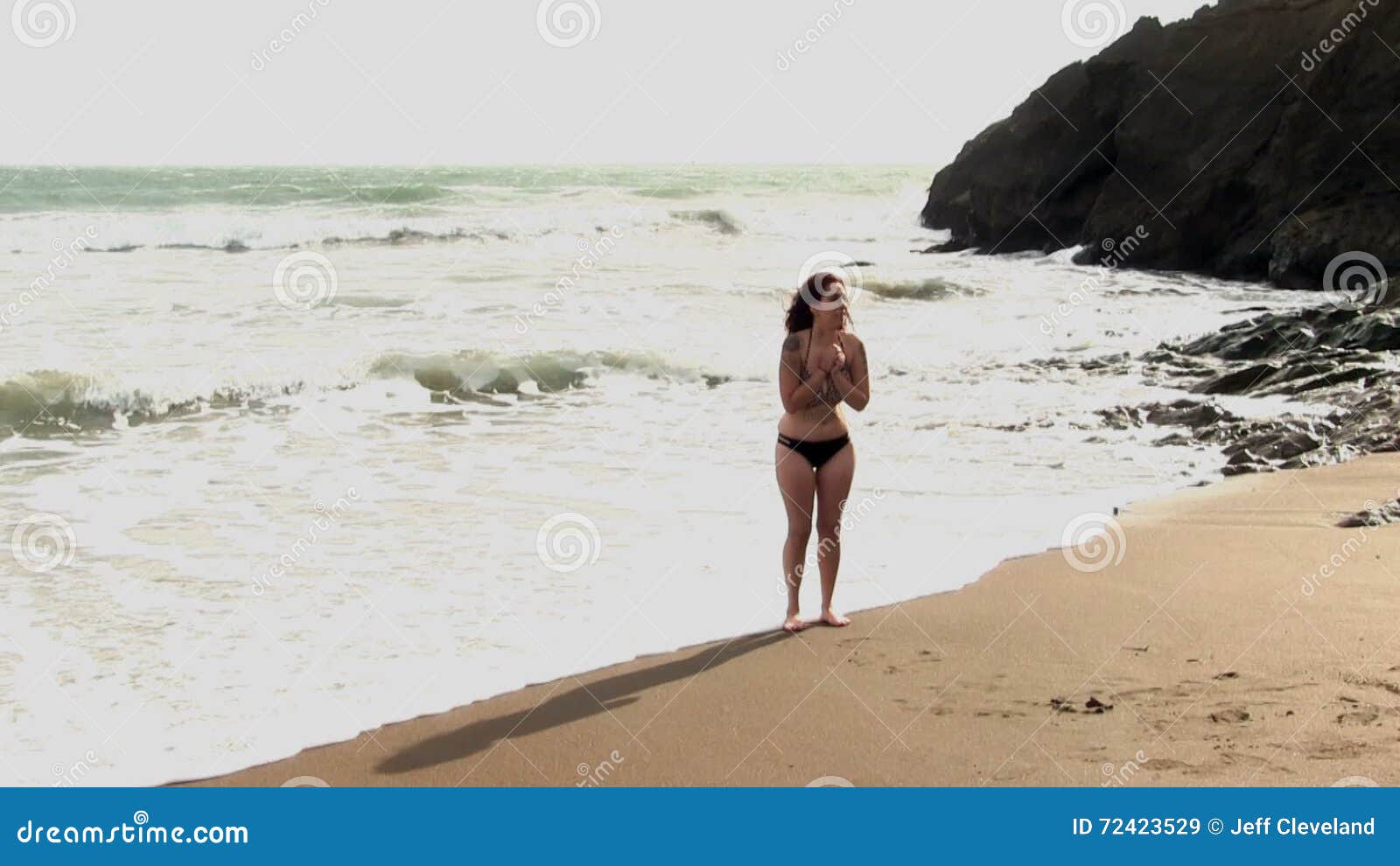 woman-standing-bikini-sandy-windy-beach-cold-rodeo-marin-california-72423529.jpg