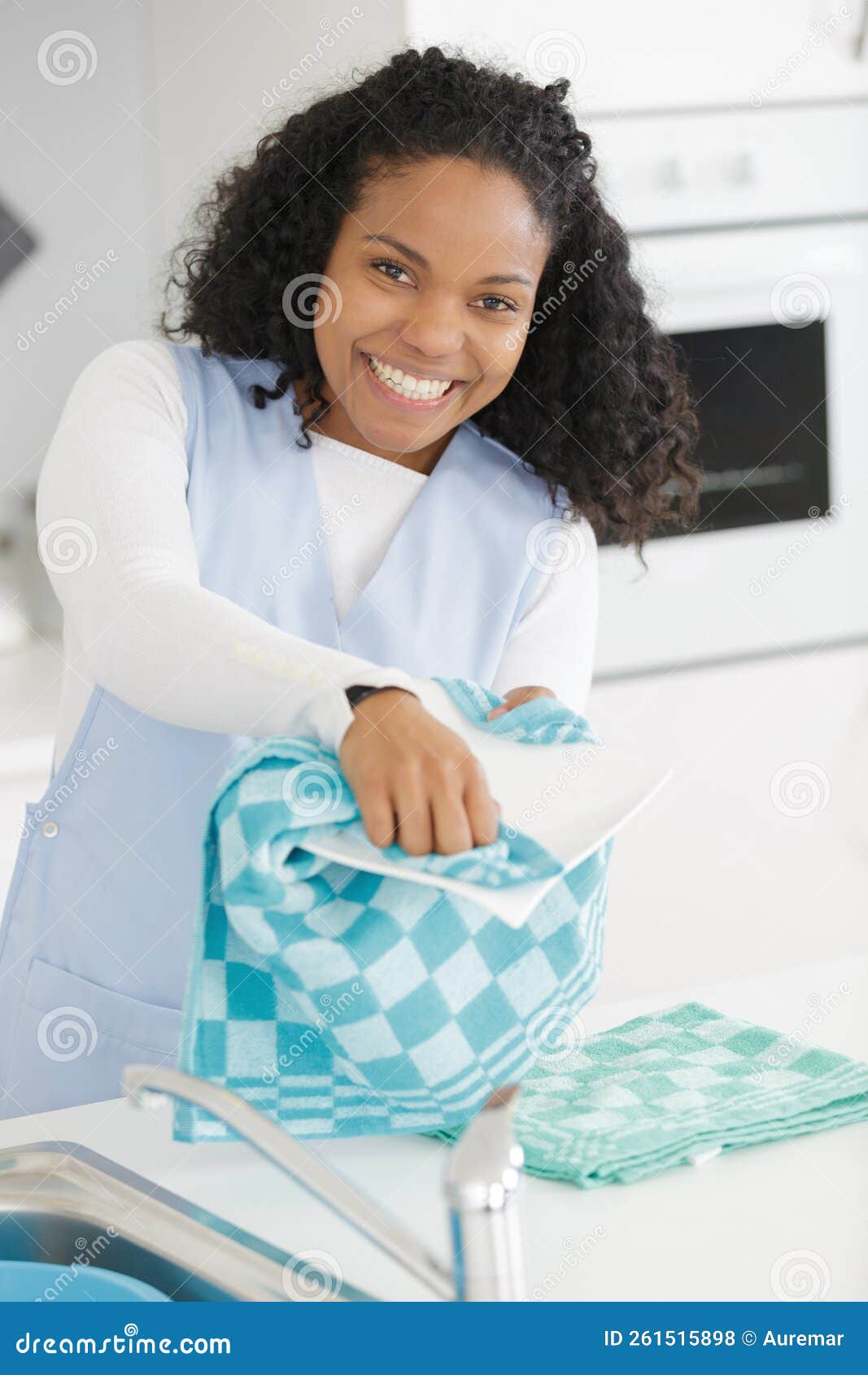 Woman Standing at Kitchen Sink Washing Up Stock Photo Image of housekeeper, mixedrace 261515898