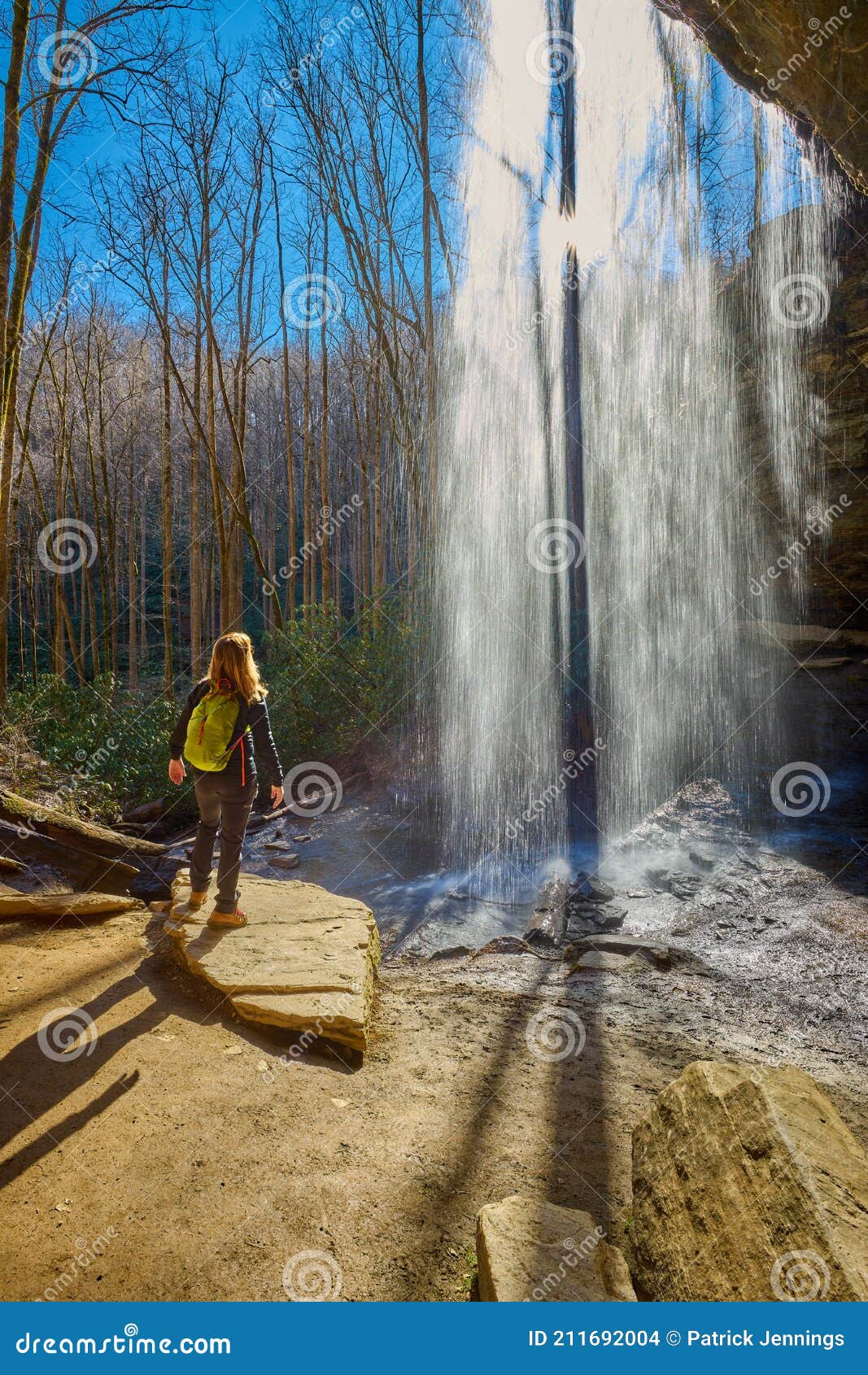 woman standing near moore cove waterfall in pisgah national forest near brevard nc