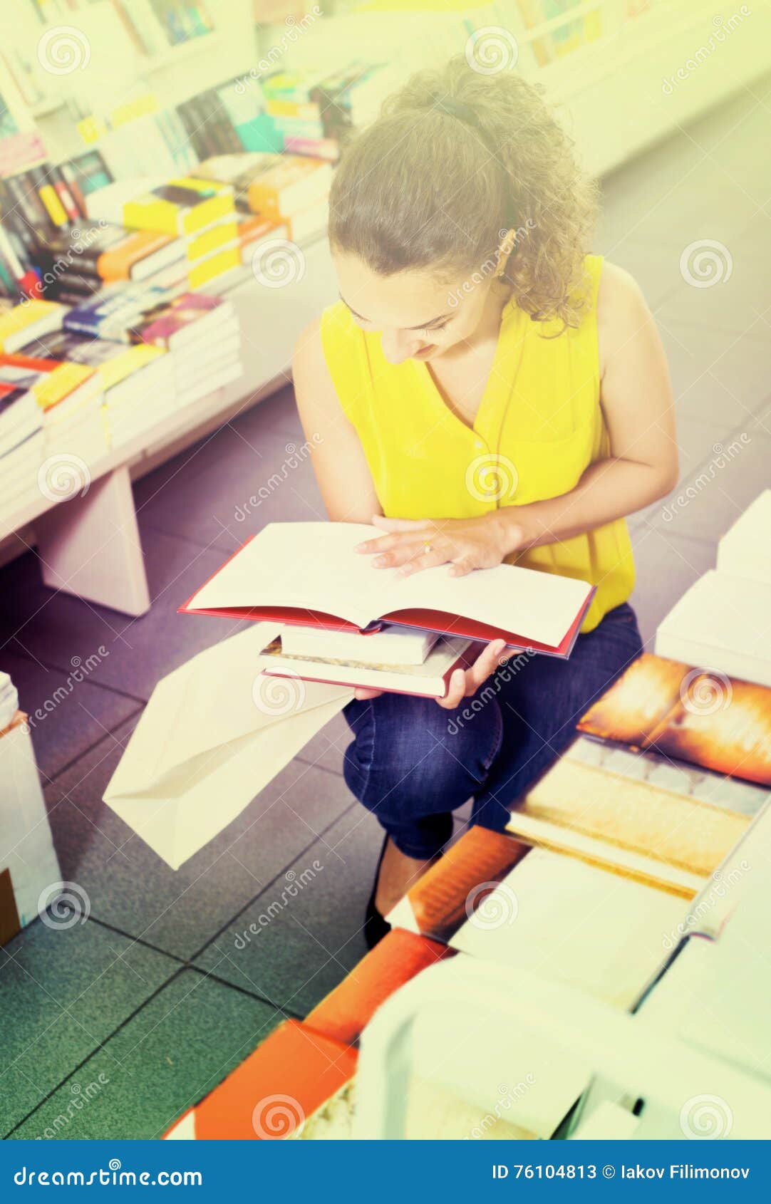 woman standing with open in publishers store