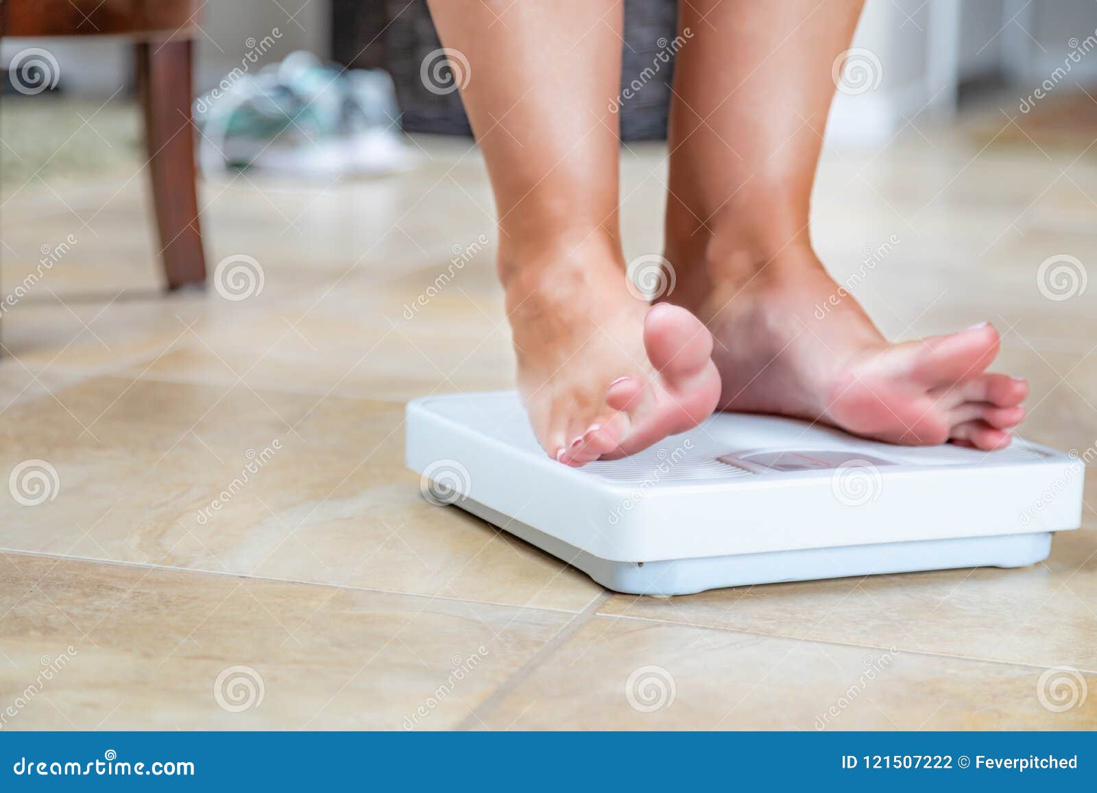 The Feet Of A Woman Standing On Bathroom Scales To Turn Stock Photo,  Picture and Royalty Free Image. Image 11153927.