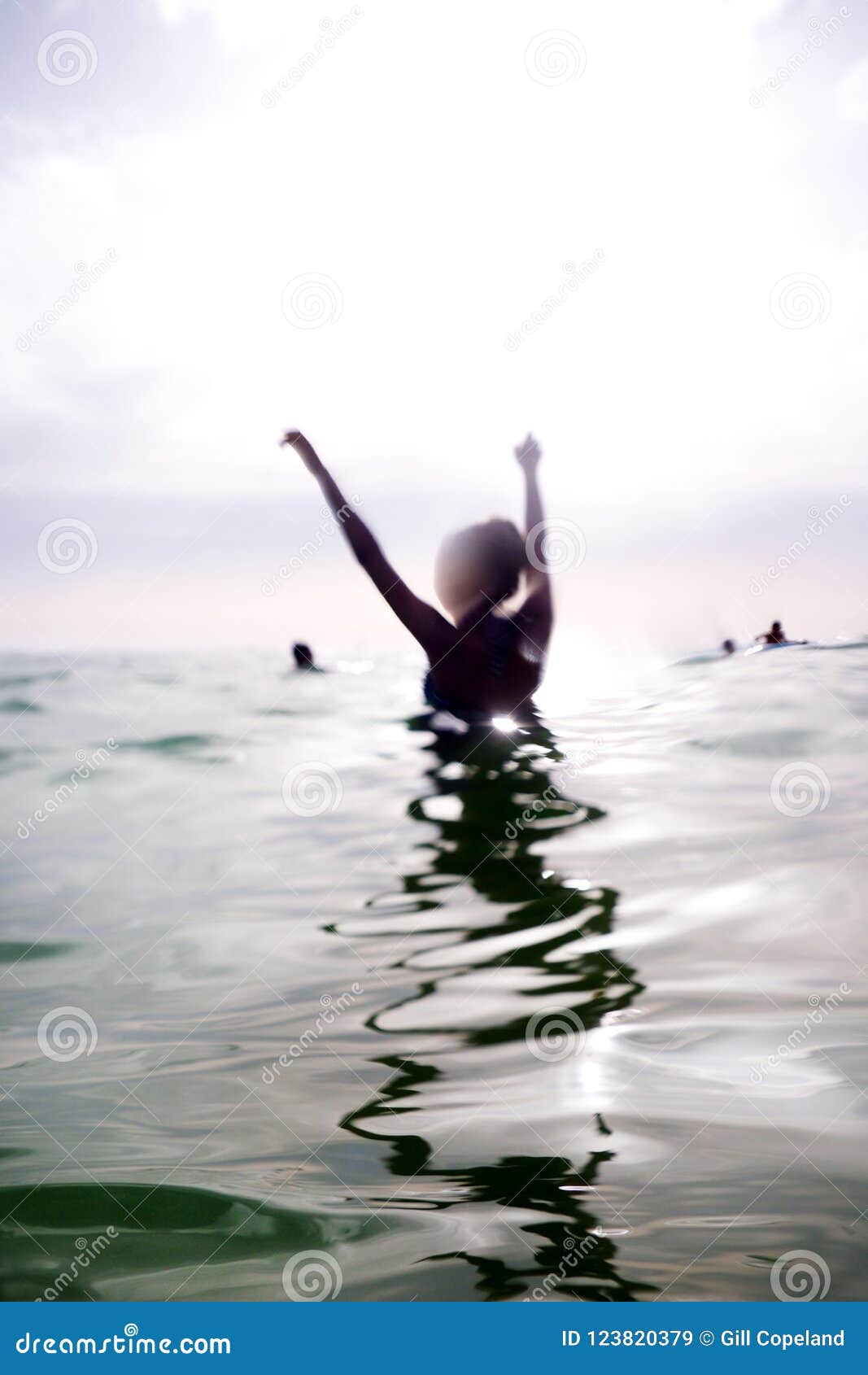 Woman in the Sea with Her Arms Up Stock Image - Image of hands, human ...