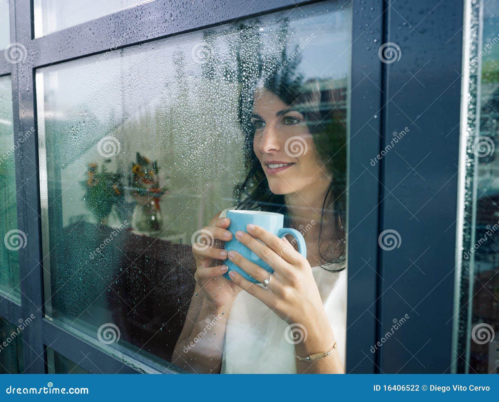 woman staring at the window