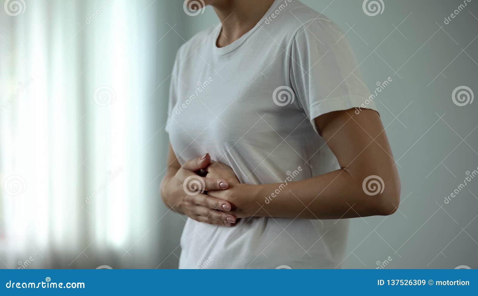 woman with stomach pain touching tummy, suffering from gastritis, pancreatitis