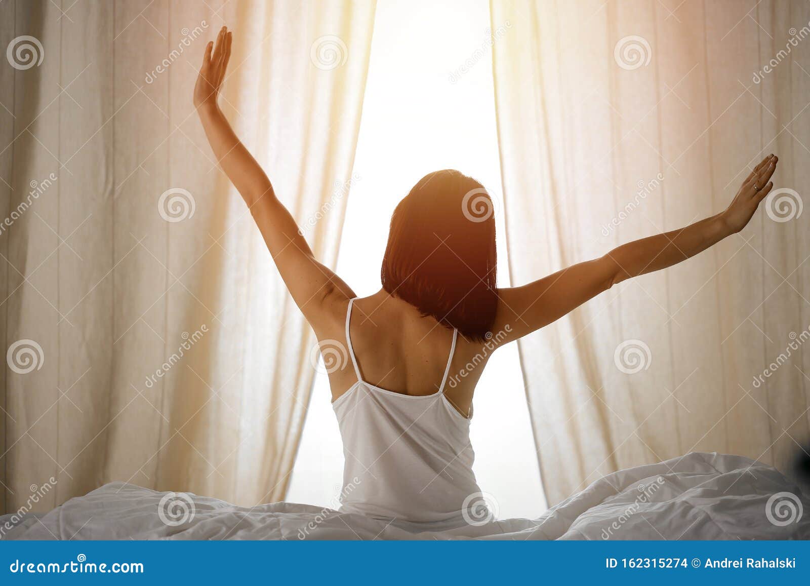 Woman Stretching Hands In Bed After Wake Up Sun Flare Brunette Entering A Day Happy And