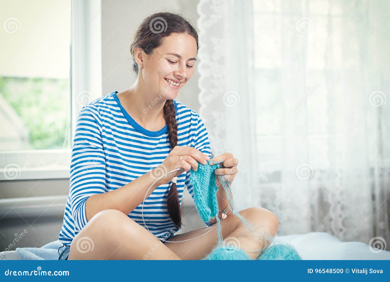 Woman in a Striped Sweater Knits Stock Photo - Image of blue, delighted ...