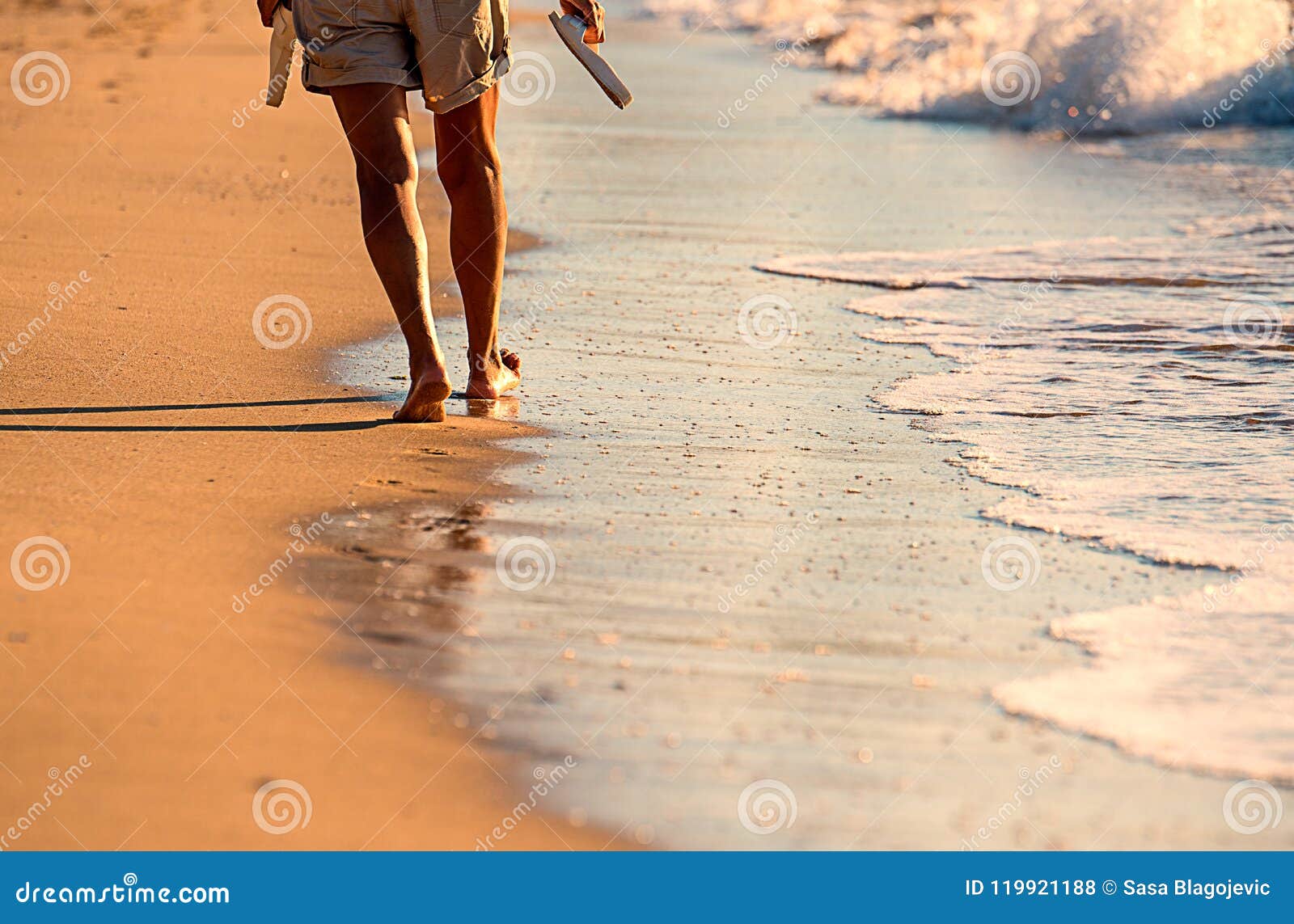 Walking on the sand stock photo. Image of people, leisure 119921188