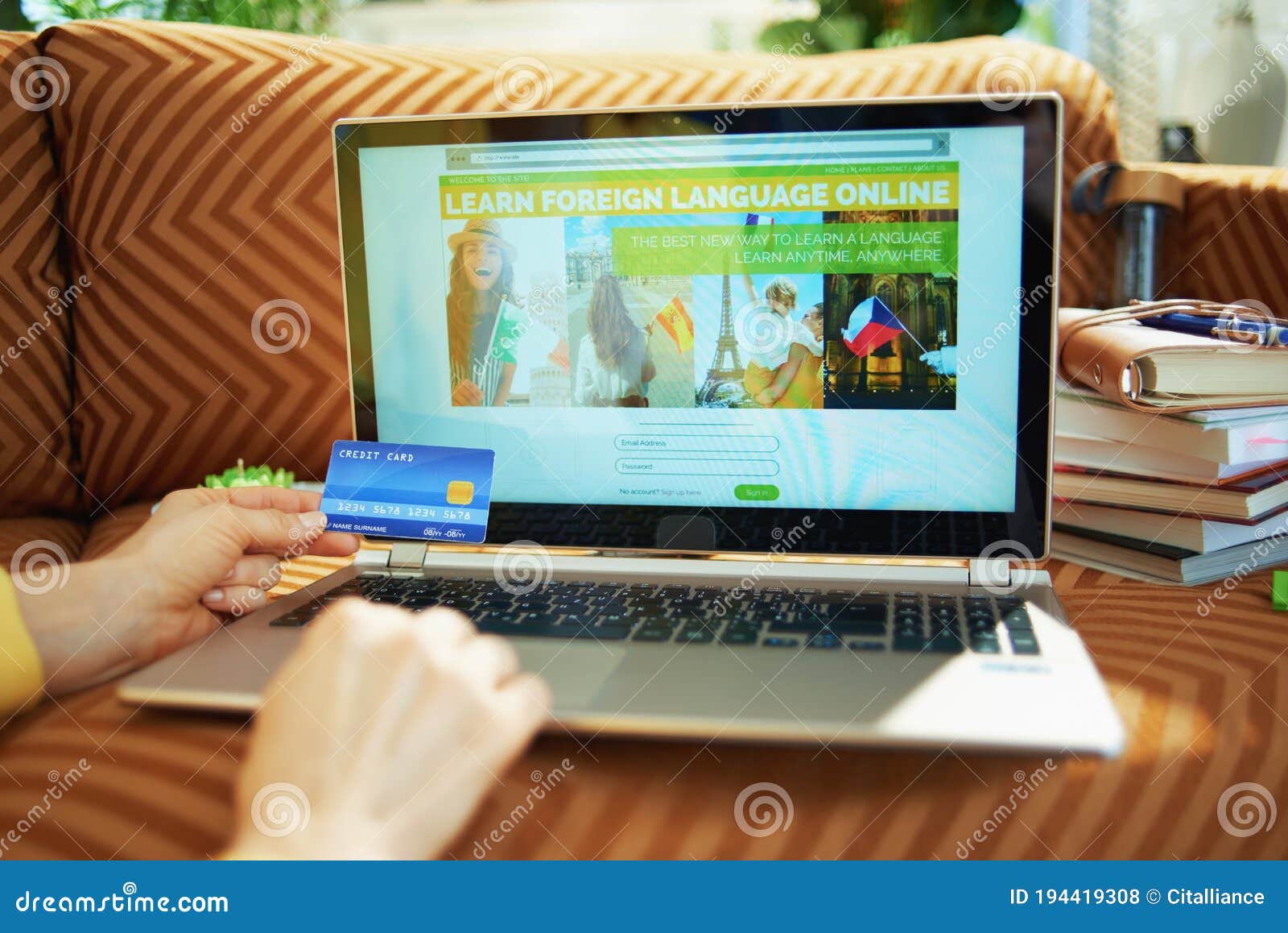 woman subscribing on learn site at home in sunny day