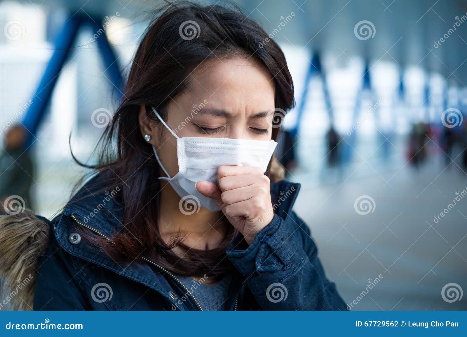 woman suffer from cough with face mask protection