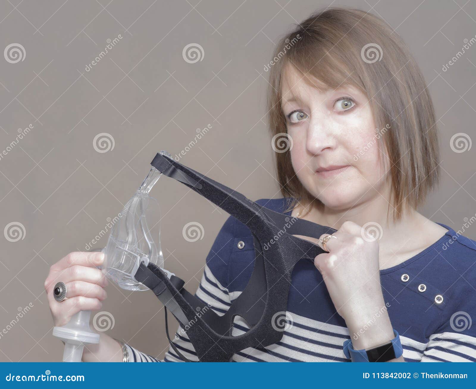 Unsure Woman Needs To Use a CPAP Mask Stock Photo Image of cpap