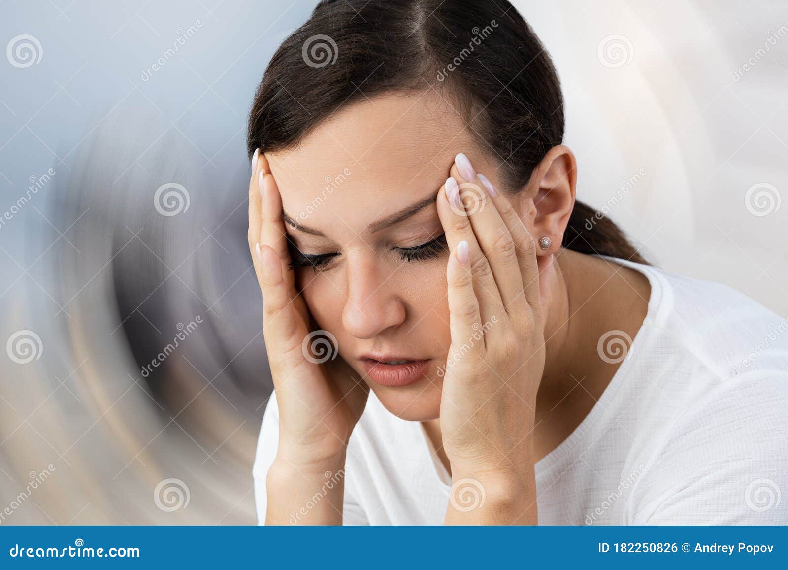 woman suffering from headache dizziness