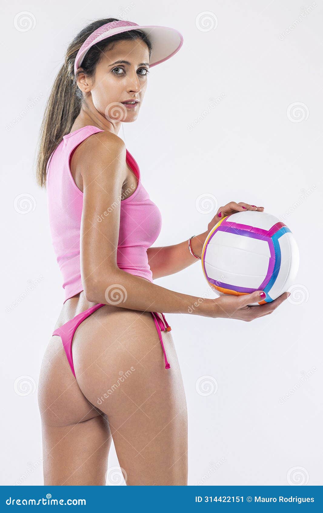 woman in bikini holding beach ball