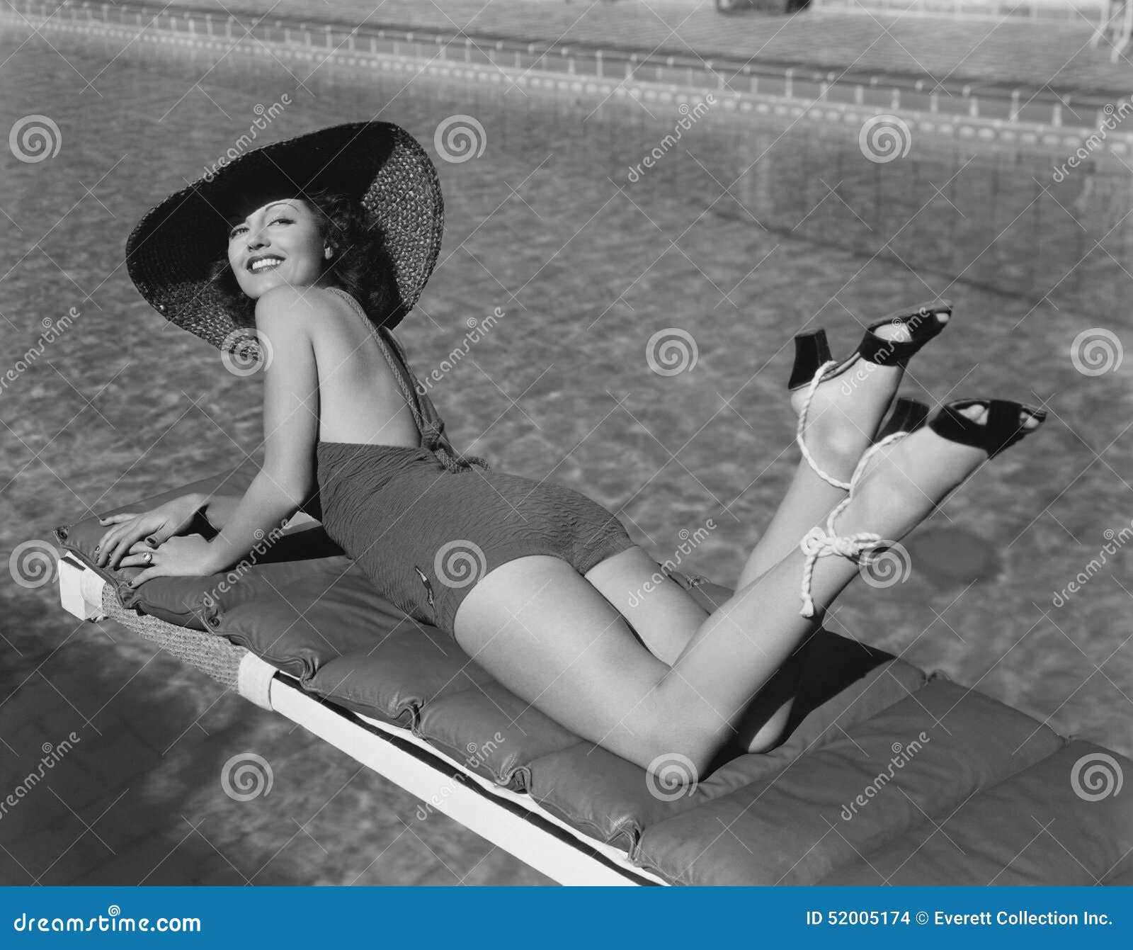 woman sunbathing at pool