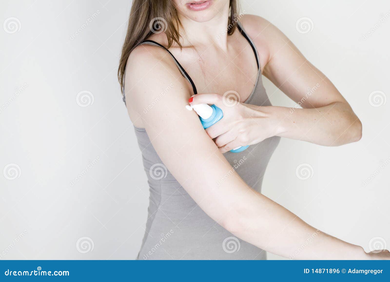 Woman with Sunburn Putting Lotion on Stock Photo Image of block