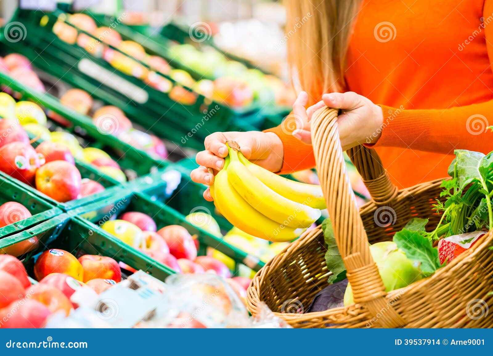 woman in supermarket shopping groceries