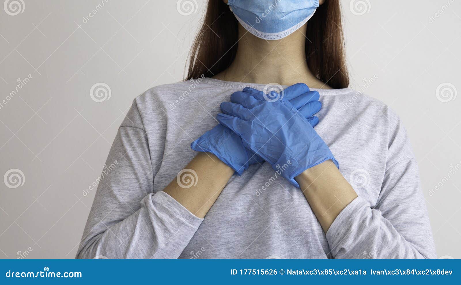 Woman With A Surgical Mask Holding Her Hands In Latex Glove O