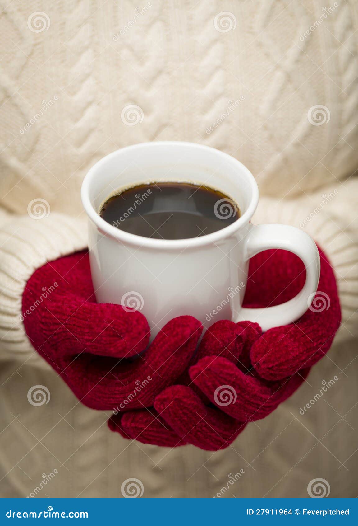 woman in sweater with red mittens holding cup of coffee