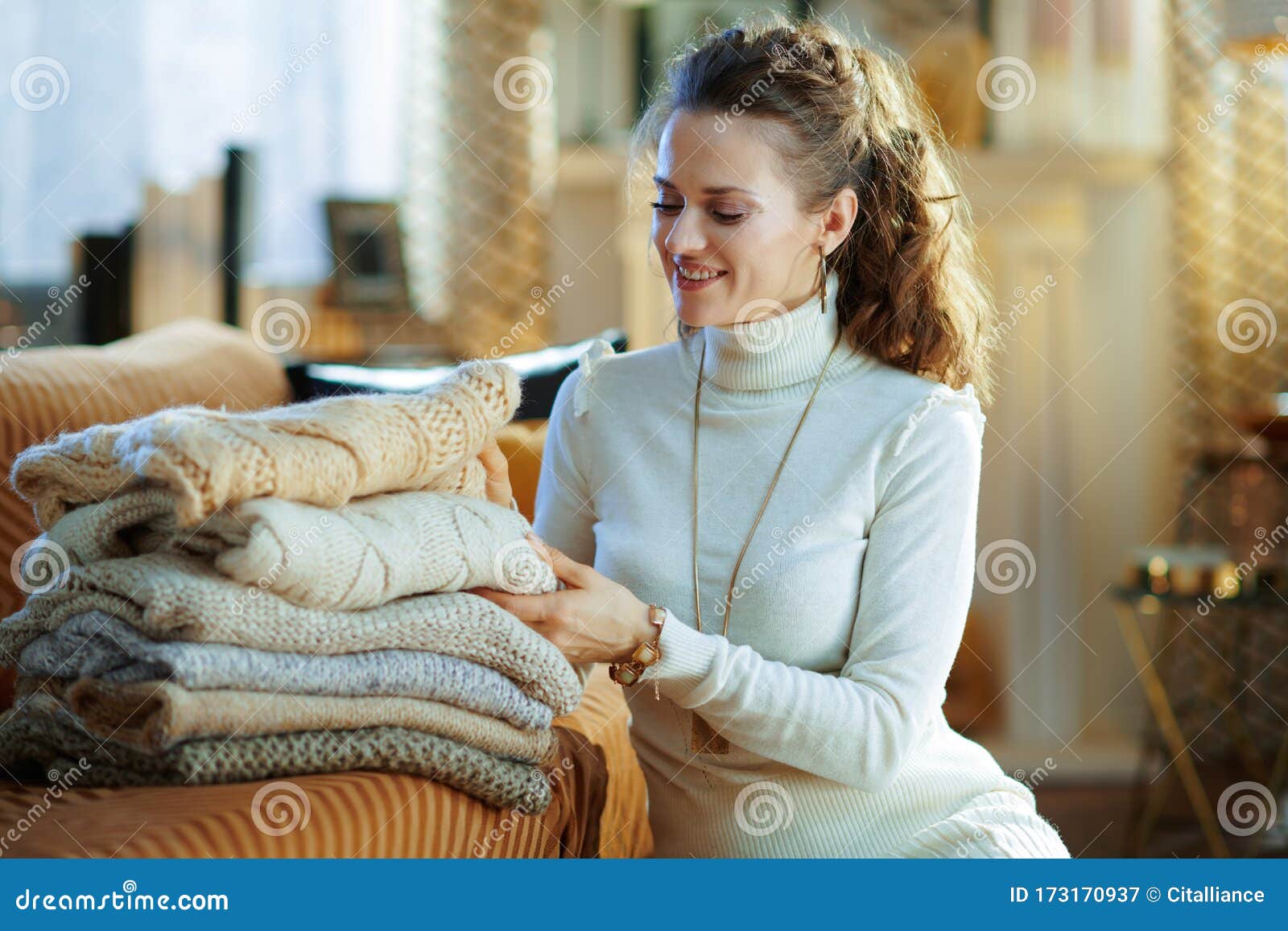 Woman with Sweaters in Modern Living Room in Sunny Winter Day Stock ...