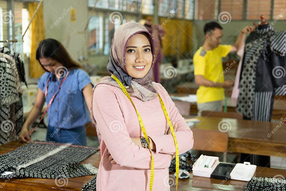 Woman Tailor with Hijab Smiling when Crossed Hands with Tape Measure ...