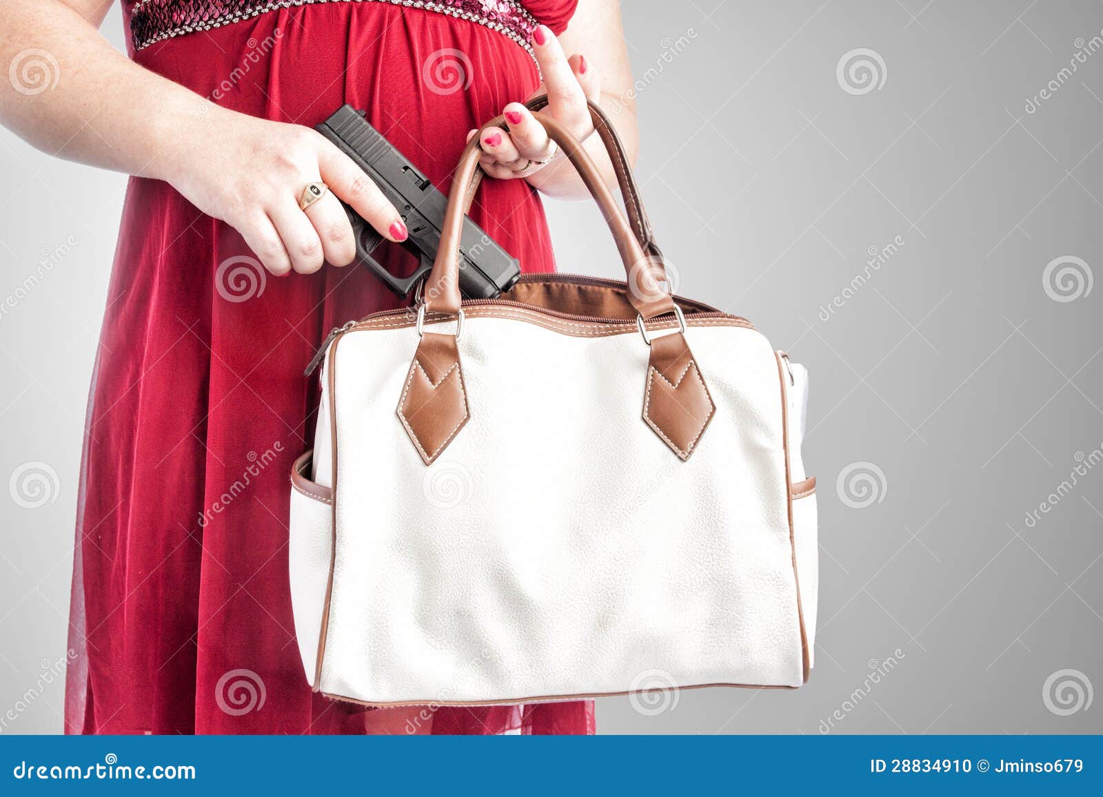 woman taking gun from purse