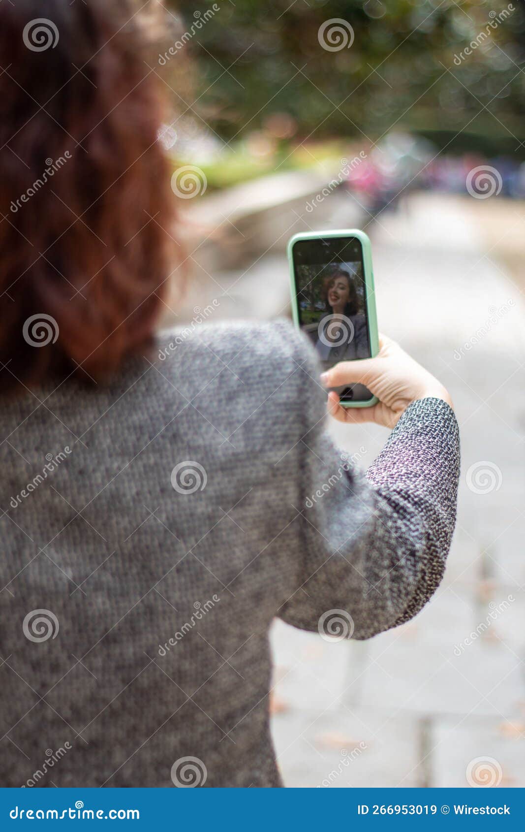 woman taking a selfie with her mobile phone.